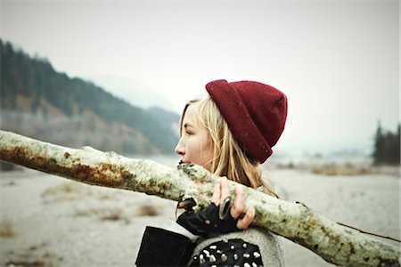 Woman holding log Stock Photo - Premium Royalty-Free, Code: 614-06897522