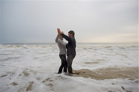 romantic couple holding hands - Mature couple dancing on beach Stock Photo - Premium Royalty-Free, Code: 614-06897719