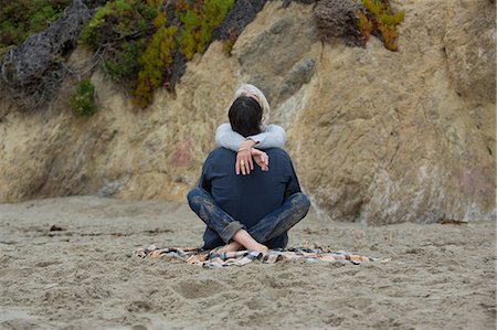 Mature couple sitting on beach cross legged, rear view Stock Photo - Premium Royalty-Free, Code: 614-06897735