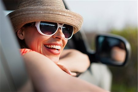 side mirror - Mature woman wearing sunglasses and sunhat Stock Photo - Premium Royalty-Free, Code: 614-06897791