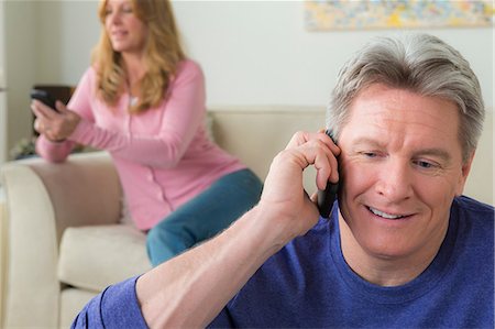 phone white woman at home - Mature man on cell phone Stock Photo - Premium Royalty-Free, Code: 614-06897819