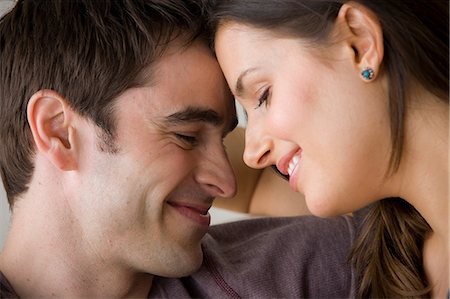 sourire - Couple face to face, close up Photographie de stock - Premium Libres de Droits, Code: 614-06897915