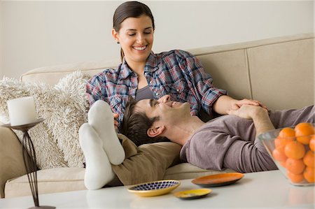 simsearch:614-06897910,k - Couple on sofa, man with head on woman's lap Photographie de stock - Premium Libres de Droits, Code: 614-06897910