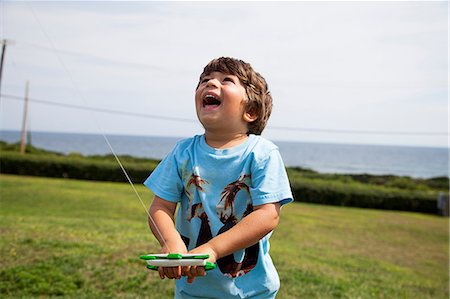 single boy - Boy flying kite Stock Photo - Premium Royalty-Free, Code: 614-06898007