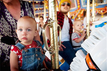 family in theme park - Family with two children on carousel Stock Photo - Premium Royalty-Free, Code: 614-06898019