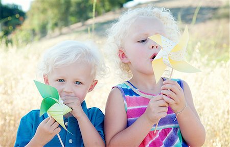 pictures of kids blowing a pinwheel - Brother and sister with pinwheels Stock Photo - Premium Royalty-Free, Code: 614-06898027