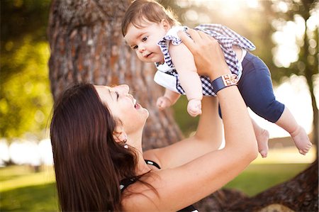 simsearch:614-06897874,k - Mother holding up baby daughter Photographie de stock - Premium Libres de Droits, Code: 614-06898054