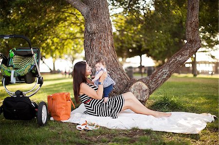 stroller - Mother sitting on picnic blanket with baby daughter Stock Photo - Premium Royalty-Free, Code: 614-06898055