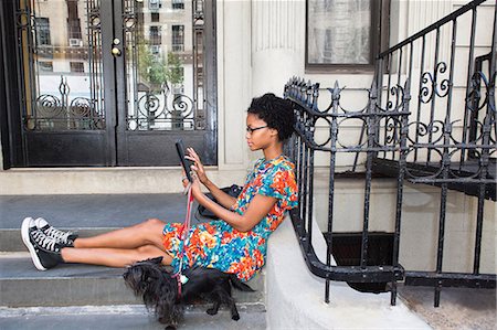 person on computer outside - Woman using digital tablet Stock Photo - Premium Royalty-Free, Code: 614-06898146