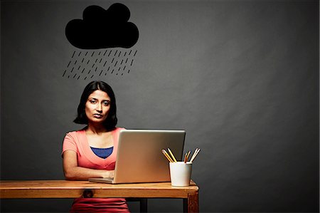 sad face and adult - Woman sitting under dark rain cloud Stock Photo - Premium Royalty-Free, Code: 614-06898212