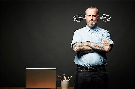 pictograma - Man with arms crossed fuming in silence Foto de stock - Sin royalties Premium, Código: 614-06898244