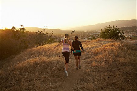 photo joyful - Women walking on dry landscape Stock Photo - Premium Royalty-Free, Code: 614-06898363