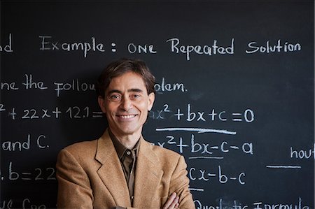 Man in front of blackboard Stock Photo - Premium Royalty-Free, Code: 614-06898448