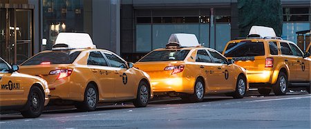 Panoramic of yellow taxis in a row, New York City, USA Stock Photo - Premium Royalty-Free, Code: 614-06974203