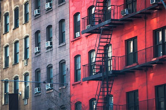 Fire escape and old apartment buildings Photographie de stock - Premium Libres de Droits, Le code de l’image : 614-06974251