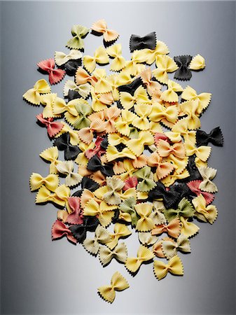 pasta nobody - Colorful still life of dried farfalle pasta Stock Photo - Premium Royalty-Free, Code: 614-06974287