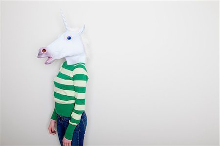 sweaters - Girl wearing unicorn head Stock Photo - Premium Royalty-Free, Code: 614-06974353