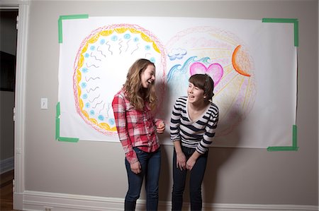 preteen girl 13 or 14 age - Girls standing in front of mural laughing Stock Photo - Premium Royalty-Free, Code: 614-06974387