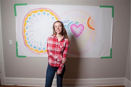 Girl standing in front of mural Stock Photo - Premium Royalty-Free, Code: 614-06974388