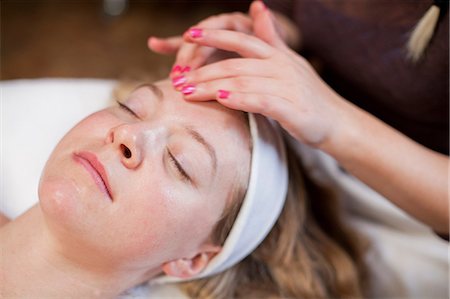 simsearch:614-06974550,k - Young woman having facial treatment Stock Photo - Premium Royalty-Free, Code: 614-06974511