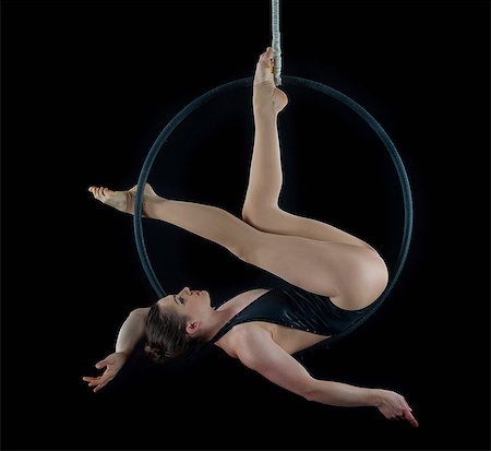 simsearch:614-06814293,k - Aerialist performing on hoop in front of black background Stock Photo - Premium Royalty-Free, Code: 614-06974626