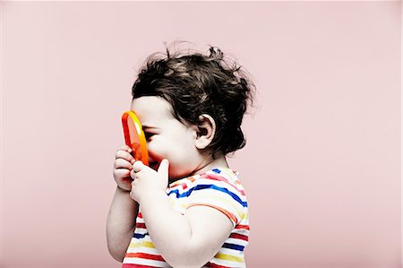 simsearch:614-08884975,k - Portrait of baby girl holding plastic toy Stock Photo - Premium Royalty-Free, Code: 614-06974704