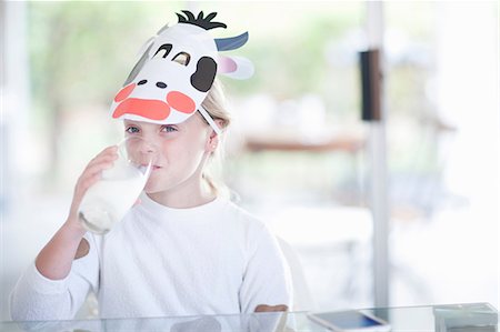 photos of kids playing inside the house - Girl drinking glass of milk Stock Photo - Premium Royalty-Free, Code: 614-06973541