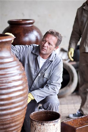 Painting and staining process in pottery factory Stock Photo - Premium Royalty-Free, Code: 614-06973627