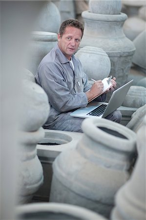 Dealing with sales in pottery factory Stock Photo - Premium Royalty-Free, Code: 614-06973622