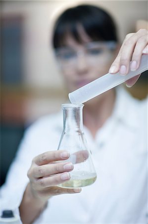 Oenologist mixing during sample testing in laboratory Stock Photo - Premium Royalty-Free, Code: 614-06973708