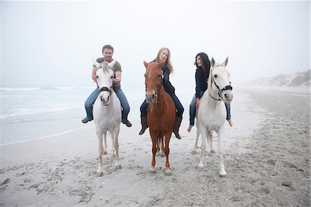 simsearch:649-06844890,k - People riding horse on beach Foto de stock - Sin royalties Premium, Código: 614-06973736