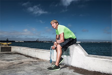 skipping ropes - Young man in sportswear resting on pier Stock Photo - Premium Royalty-Free, Code: 614-06973912