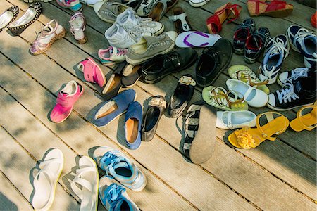 simsearch:632-05992198,k - Large group of shoes on wooden planks Stock Photo - Premium Royalty-Free, Code: 614-07031207