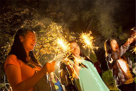 Girls with sparklers at night Stock Photo - Premium Royalty-Free, Code: 614-07031248