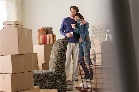 Couple having a drink break whilst moving Stock Photo - Premium Royalty-Free, Code: 614-07031330