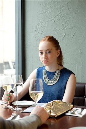 Young woman in restaurant Stock Photo - Premium Royalty-Free, Code: 614-07031524