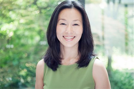 east asian ethnicity - Mature woman smiling, portrait Stock Photo - Premium Royalty-Free, Code: 614-07031585
