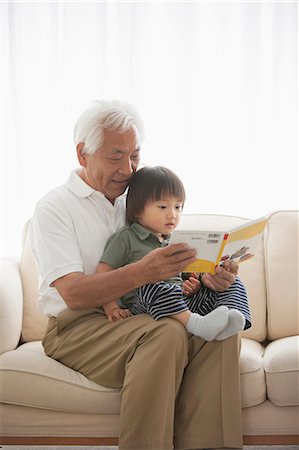 photos of asian families - Grandfather reading to grandson Stock Photo - Premium Royalty-Free, Code: 614-07031627