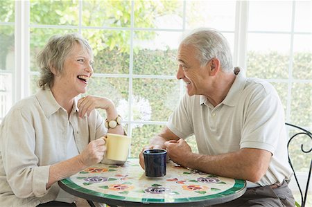 senior couple table - Senior couple at table in conservatory Stock Photo - Premium Royalty-Free, Code: 614-07031727