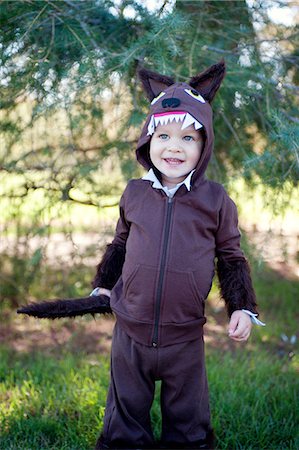 sunlight fun outdoor game - Male toddler in woods dressed up in wolf costume Stock Photo - Premium Royalty-Free, Code: 614-07031857