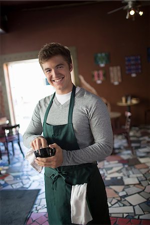 simsearch:649-05648984,k - Portrait of young waiter in cafe Photographie de stock - Premium Libres de Droits, Code: 614-07032005