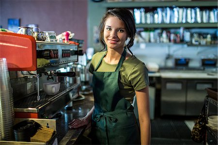 Portrait of teenage waitress in coffee house Stock Photo - Premium Royalty-Free, Code: 614-07032008