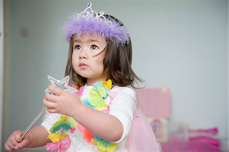 fairytale costumes for girls - Girl in fairy costume holding magic wand Stock Photo - Premium Royalty-Free, Code: 614-07032015