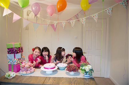 east asian ethnicity girl cake - Girls sharing birthday cake at party Stock Photo - Premium Royalty-Free, Code: 614-07032034