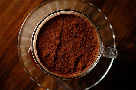 Still life of cup of coffee with chocolate powder Stock Photo - Premium Royalty-Free, Code: 614-07032095