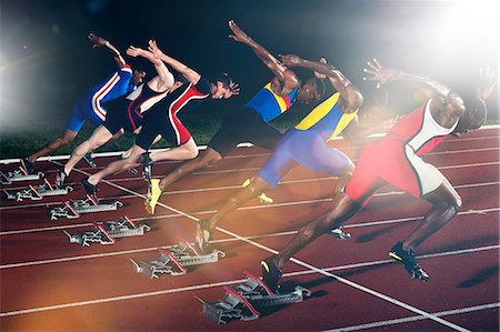 Six athletes starting race at night Stock Photo - Premium Royalty-Free, Code: 614-07145727