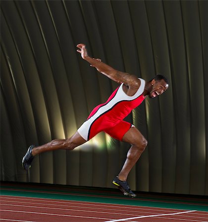 stadium flood light - Athlete finishing race Stock Photo - Premium Royalty-Free, Code: 614-07145736