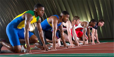 stade sportif - Athletes on start line of race Photographie de stock - Premium Libres de Droits, Code: 614-07145732