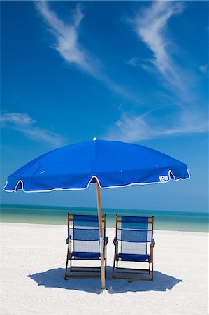 deck chairs - Deckchairs and parasol on beach, Clearwater, Florida, United States Stock Photo - Premium Royalty-Free, Code: 614-07145781