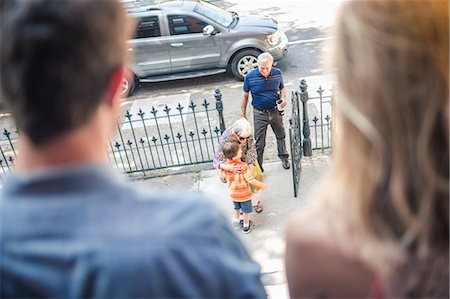 Grandparents arriving, boy hugging grandmother Stock Photo - Premium Royalty-Free, Code: 614-07145875